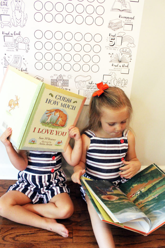 Girls reading favorite books under the summer reading calendar