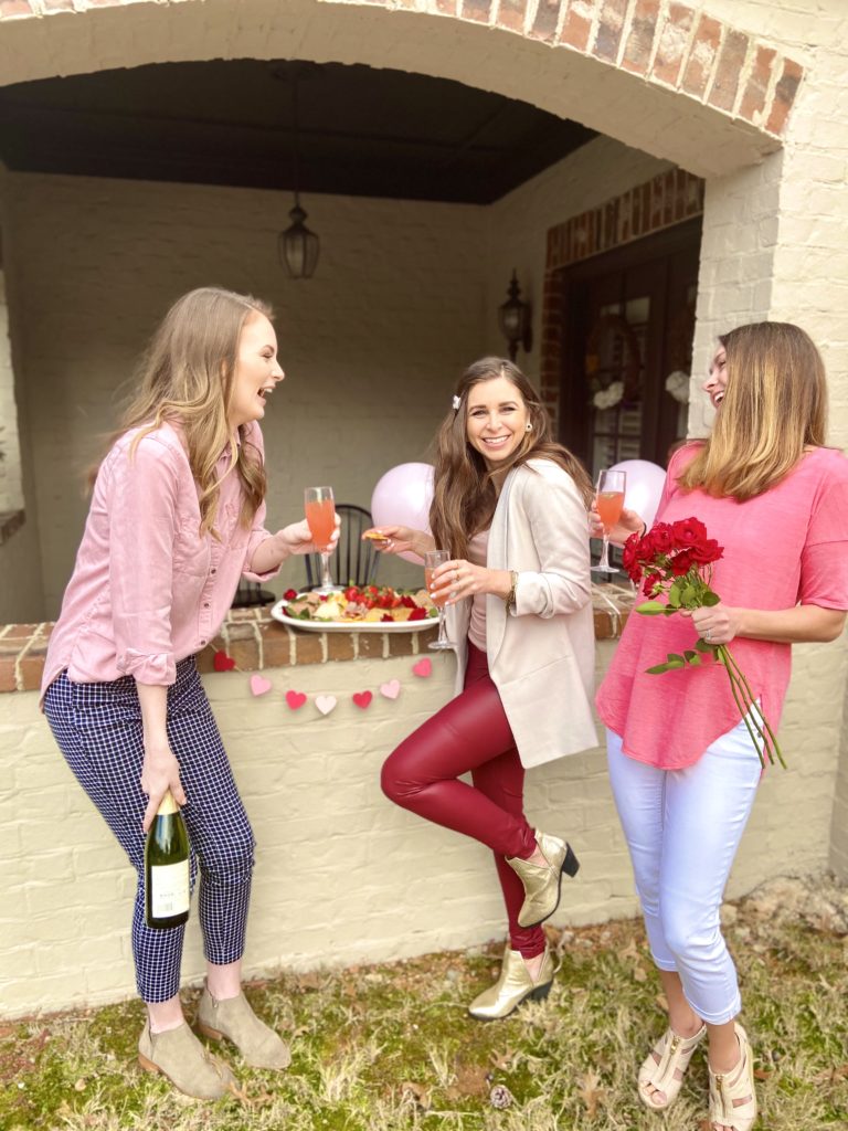Girls holding drinks and celebrating Valentine's Day